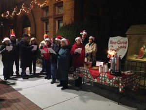 Saturday Knights Club caroling at the Creche